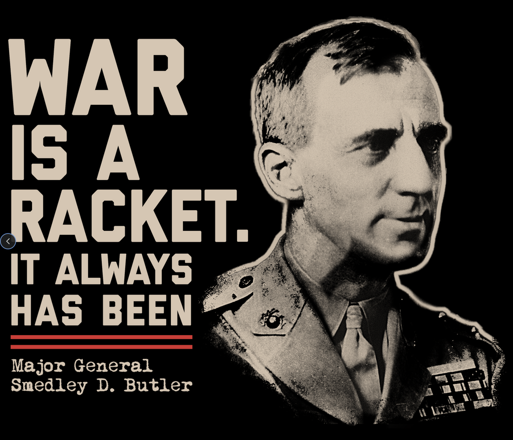 Black short-sleeve tee with beige bold text "WAR IS A RACKET. IT ALWAYS HAS BEEN." and a sepia-toned portrait of Major.