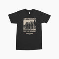 Black crewneck t-shirt with vintage-style graphic of armed women and text "ANTIFASCIST Just Like Grandma On Offense" in.